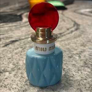 Miu Miu Light Blue Bottle with Red Cap